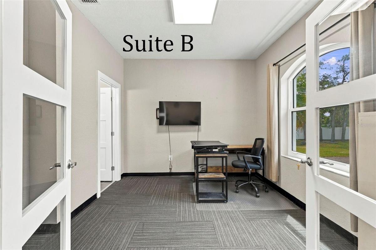 Double Glass Doors into Suite B, with Private Full Bathroom, Window to the Front of the Office, located by the Lobby