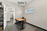 Suite C has 2 high windows and is located by the Coffee Station, Hall Restroom and Covered Patio Break Common Area