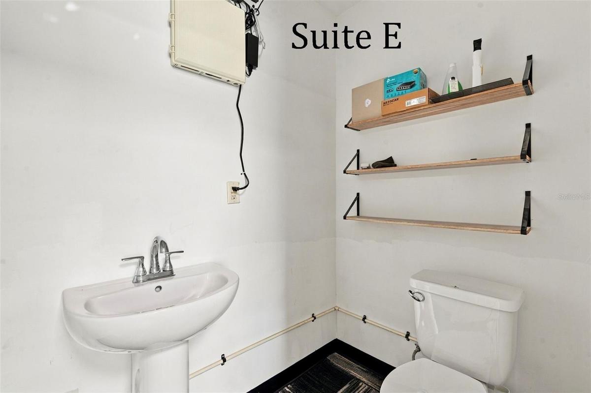 Suite E has a private entrance, large window overlooking the landscaping, a private restroom and has access to the Covered Patio Break Area