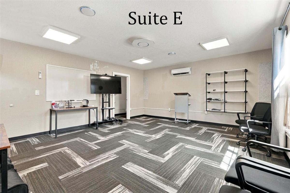Suite E has a private entrance, large window overlooking the landscaping, a private restroom and has access to the Covered Patio Break Area