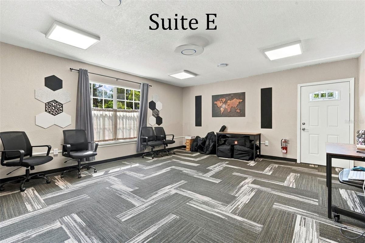 Suite E has a private entrance, large window overlooking the landscaping, a private restroom and has access to the Covered Patio Break Area