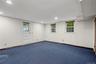 just a few steps down from main floor  - this garden level room has door to backyard and ideal for media, recreation room or playroom