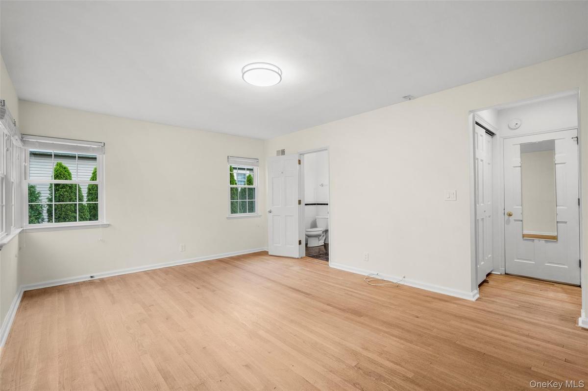 Spacious  Bedroom with 3 windows  and ensuite bath and 2 closets
