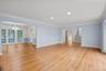 Living room opens to large dining room, ideal for entertaining