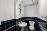 Powder room with window adjoining family room