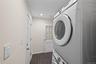 Washer/dryer located off of kitchen. Leads to 4th bedroom and office space. Door to garage