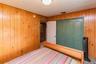 Wood paneling, recessed lighting, carpet flooring, bi-fold closet doors