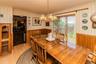 Dining area featuring wood-finish flooring and wainscoting