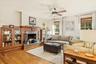 Den with wood burning fireplace, Hardwood flooring