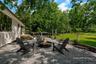 Virtually staged chairs and fire pit.