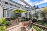 Private front courtyard with brick patio and lovely gardens