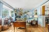 Bay window with multiple panes, hardwood flooring
