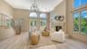 Dramatic 14 foot vaulted ceilings, arched windows and abundant natural light define the elegant main living space.