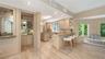The kitchen opens naturally to the surrounding living spaces, creating an easy flow for everyday living and entertaining.