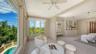 Large windows capture treetop and pool views while filling the primary retreat with beautiful natural light.