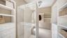 Custom designed storage provides extensive organization within the private primary suite level.