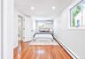 Bedroom featuring wood-finish flooring, recessed lighting, and a split-unit air conditioning system