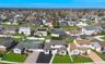 Aerial perspective showcasing a residential neighborhood with diverse housing styles