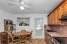 Kitchen With Door Leading To Wood Deck