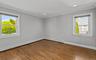 Hardwood flooring, crown molding, recessed lighting, and dual windows