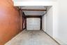 Single car space with concrete flooring