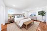 Virtually staged. Hardwood flooring, multiple windows, recessed lighting, and a neutral color palette