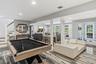 Recreational space featuring a wine room and glass French doors to outdoor covered patio.