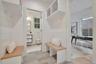 Sample of mudroom with benches and cubbies linking the attached garage to the home