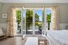 French doors open to waterfront balcony