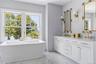 Freestanding soaking tub with a  dual vanity and waterviews