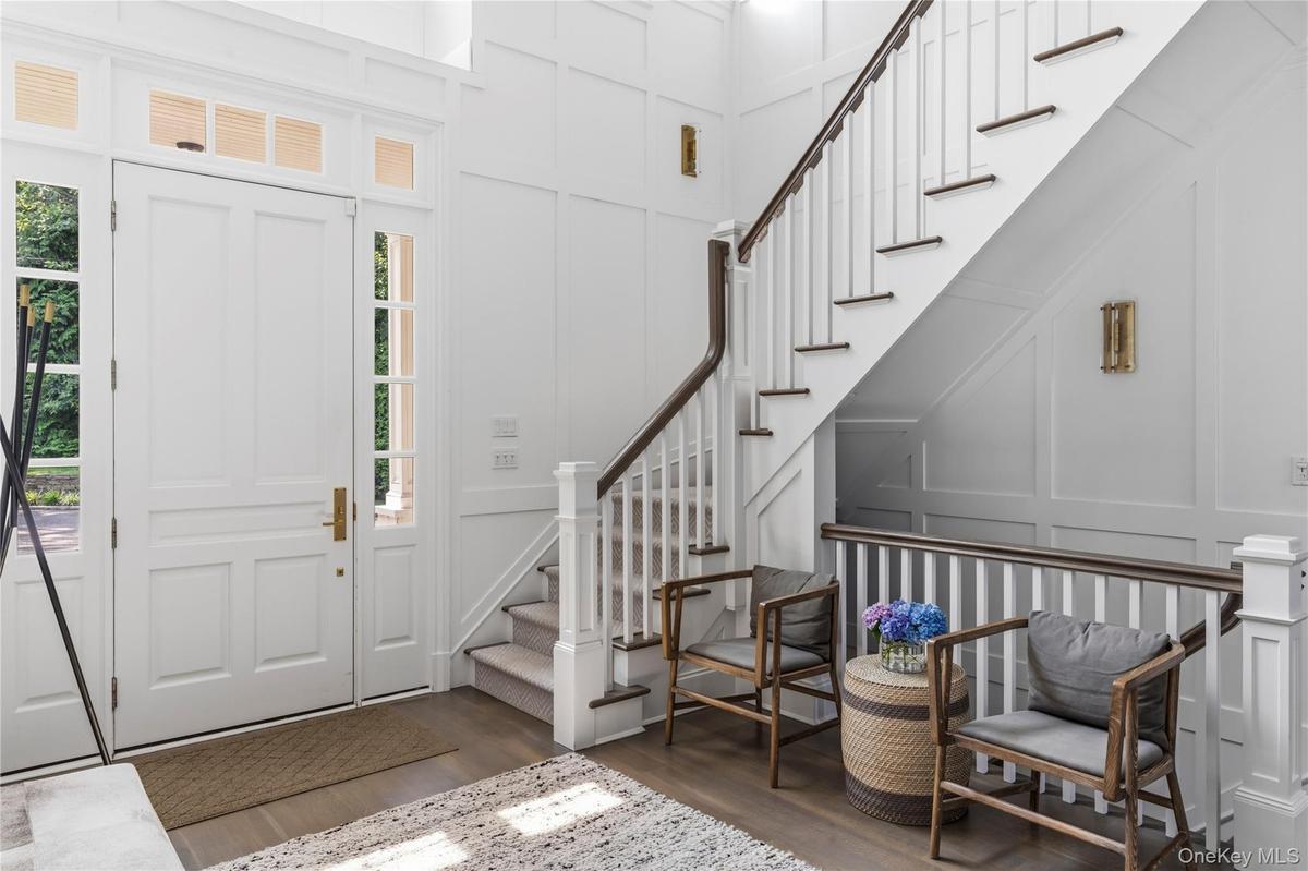 Grand entryway featuring beautiful moldings.