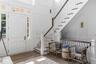 Grand entryway featuring beautiful moldings.
