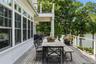 Expansive deck with cable railing, covered section and offering direct waterfront access