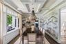 Coffered ceiling with expansive windows with waterviews