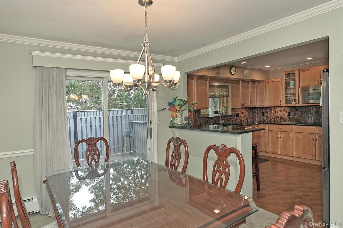 Dining Area with Sliders to Deck
