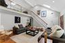 Entry with View of Stairs and Loft with 2 Skylights