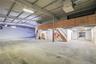 Garage featuring a heating unit