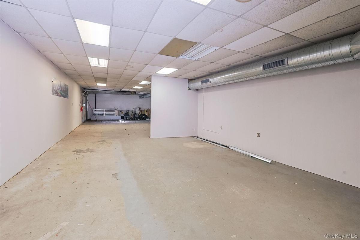 Basement with a paneled ceiling