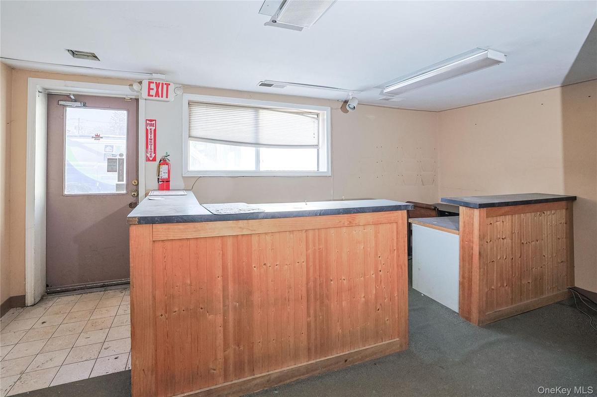 Kitchen featuring dark countertops and a kitchen island