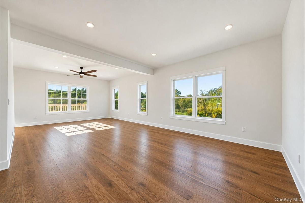 Virtually Staged - Living Room. First Floor will have hardwoods. Railings will have black spindles and oak railing.