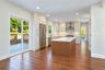 Virtually Staged - Kitchen. First Floor will have hardwoods. Kitchen cabinets in white/dove color. Island will be similar to the hardwoods.
