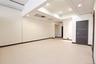 Spacious open floor plan with pristine neutral carpeting, recessed ceiling lighting, and modern architectural finishes