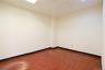 Light-colored walls, wood-finish flooring, and recessed ceiling lighting