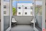 Walk- out covered balcony off