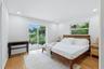 Both of the en-siut bedrooms  have private sliding door access to the Bohemian Garden, where the backyard greenery subtly reaches into the rooms, maki