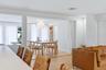 The area then flows from this point through to the dining room, highlighted by a built-in bookcase and accented by a magnificent Noguchi-Style Shoji P