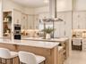 Virtually staged Re-Imagined Creamy Oak Kitchen