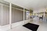 The spacious screened lanai offers a long stretch of covered outdoor living space with plenty of room for dining, lounging, and gathering while stayin
