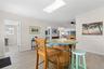 The spacious dining area is filled with natural light from the skylight and flows easily into the adjoining kitchen and living spaces, with 2025 luxur