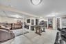 Expansive basement featuring tile flooring and recessed lighting